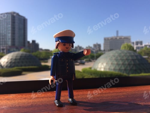 Preview: Toy Police Officer Directing Traffic in the City