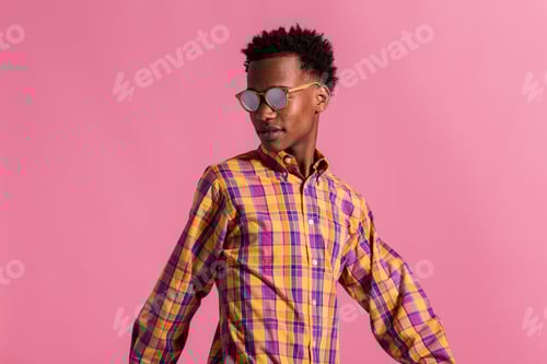 Preview: Stylish Young Man in Plaid Shirt and Shades