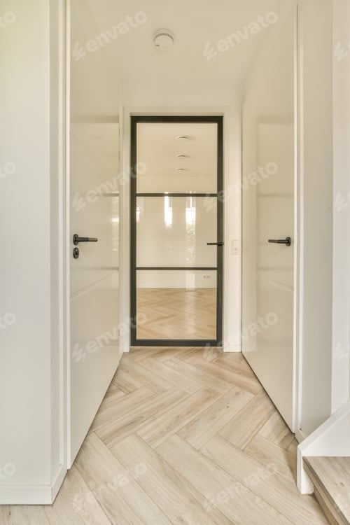Preview: a hallway with white walls and a sliding glass door