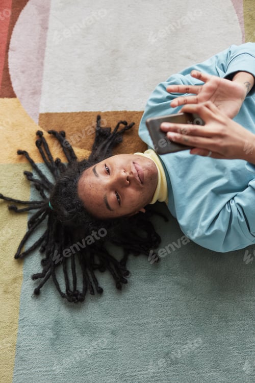 Preview: Real African American Woman Lying on Floor and Texting