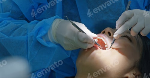 Preview: Woman under dental check up in clinic