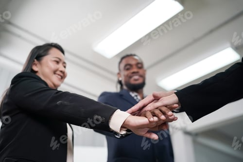 Preview: Business people working on business project in office. hand shaked and unity concept.