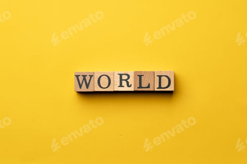 Preview: a yellow warm background without shadows wooden cubes with black letters laid out word world