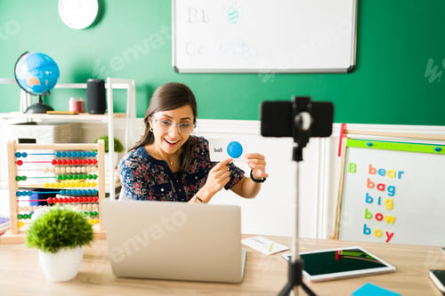 Preview: Hispanic woman teaching little kids from home