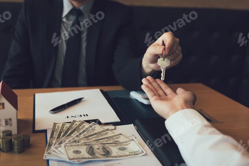 Preview: Salesman house brokers provide key to new homeowners in office.