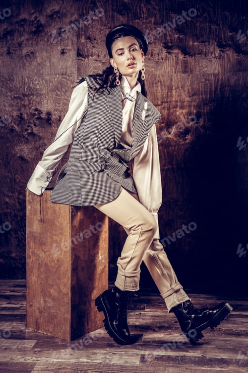 Preview: Modern Photo Studio. Beautiful Young Woman Posing On The Stool While Being In The Photo Studio