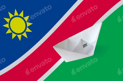 Preview: Namibia flag depicted on paper origami ship closeup. Oriental handmade arts concept