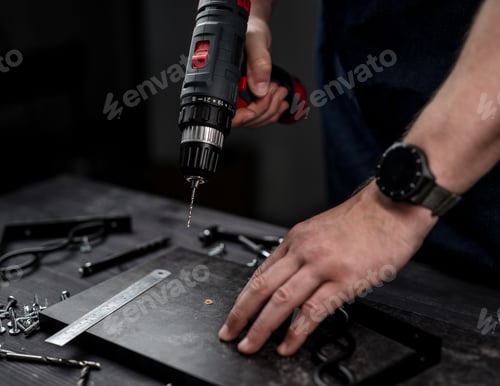 Preview: Man Holds Screwdriver