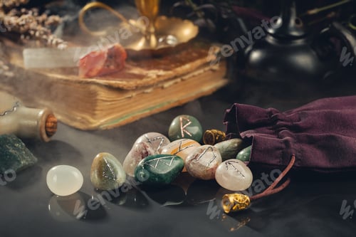 Preview: Rune Stones, Old Book and Crystals on Black