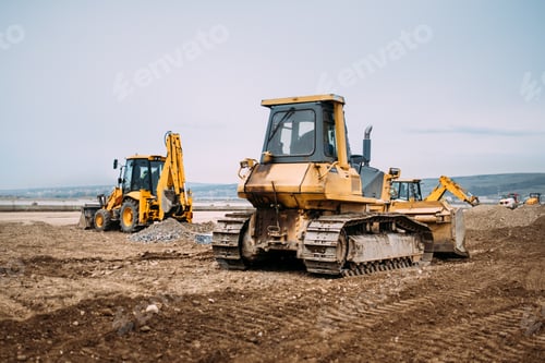 Preview: Industrial motor grader and backhoe excavator on highway construction site
