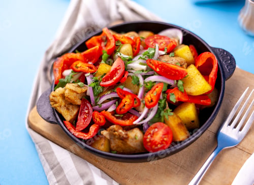 Preview: Pork ojakhuri with vegetables. Meat, potatoes, onions, herbs, peppers cooked and served in a skillet