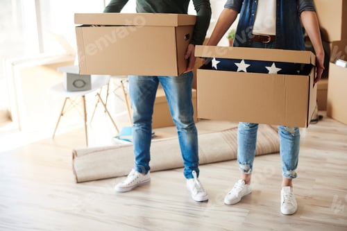 Preview: Couple standing holding cardboard boxes
