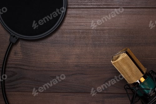 Preview: Vintage Condensing Microphone And Pop Filter On Wooden Background