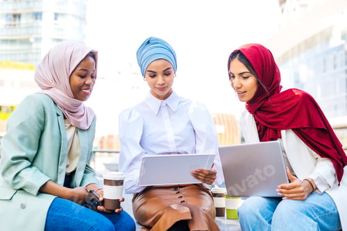 Preview: Beautiful muslim girl wearing hijab bonding outdoors
