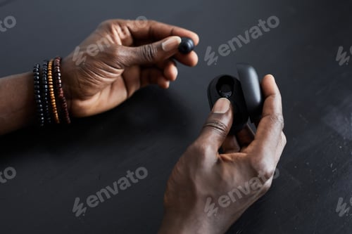 Preview: Man using wireless headphones to listen to music