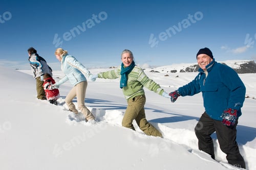 Preview: Italy, South Tyrol, Seiseralm, Family walking in snow