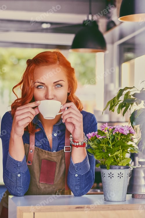 Preview: Female barista in a small coffee shop.