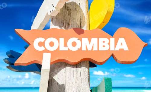 Preview: Colombia Signpost With Beach Background