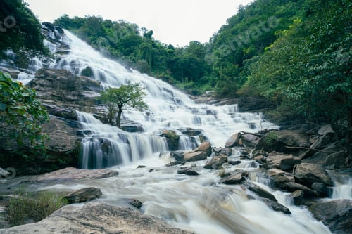Preview: Beautiful waterfall in lush tropical green forest. Nature landscape. Mae Ya Waterfall in Chiang Mai