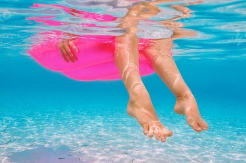 Preview: Woman Relaxing On Inflatable Mattress At The Beach, View From Underwater