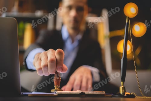 Preview: hand stamping with approved stamp on approval certificate document public paper at desk