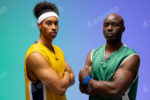 Preview: Image of portrait of two diverse basketball players facing each other on purple to green background