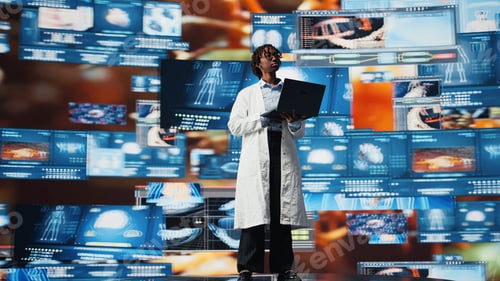 Preview: Female scientist looking at genomes on laptop screen