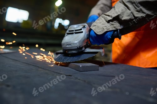 Preview: Steel Plant Worker Using Angle Grinder