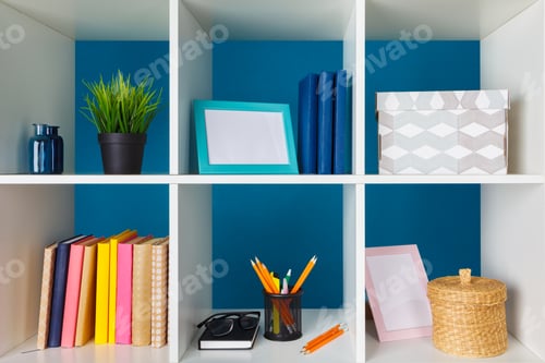 Preview: White office shelves with different stationery, close up