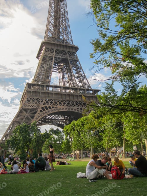 Preview: Friends, families enjoying sunset & picnics by the Eiffel tower. Parisians tradition. People & City