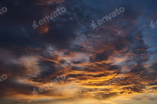 Preview: Background of vivid light of sunset with the dark cloud