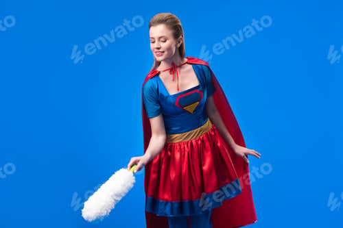 Preview: portrait of woman in superhero costume with dust cleaning brush isolated on blue