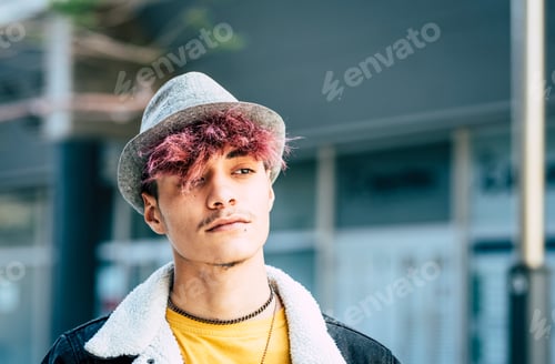 Preview: Diversity people portrait young teenager hispanic race with violet hair and hat - teen male