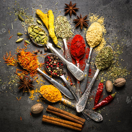 Preview: Set of various spices on black stone background.