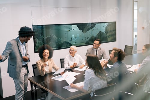 Preview: Portrait of successful business team working in office