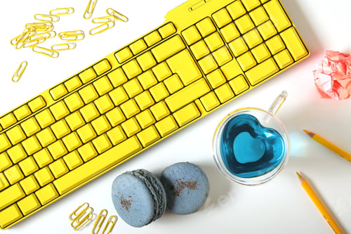 Preview: The Keyboard Is Bright, Paper Clips, Tea, Pencils Are On A White Background