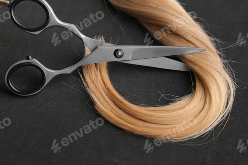 Cutting Blonde Hair with Silver Scissors, Close Up