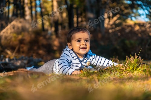 Preview: A baby having fun in the Artikutza natural park on an autumn afternoon