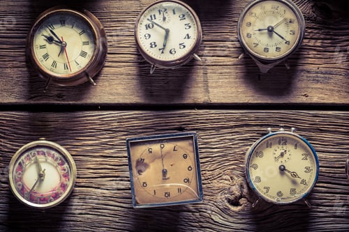 Preview: Aged wooden wall with clocks