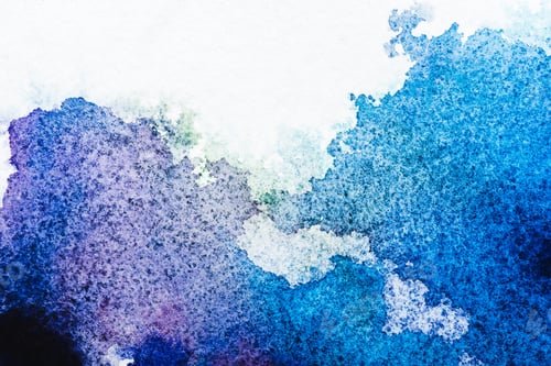 Preview: top view of blue and grey watercolor spills on white paper