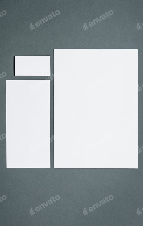 Preview: Mock-up business template with cards, papers, pen. Gray background.