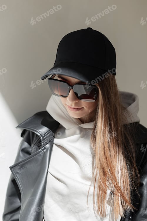 Preview: Stylish beautiful fresh woman in fashion clothes walking on a spring day