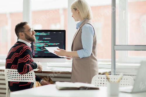 Preview: Application programmers discussing code for new app
