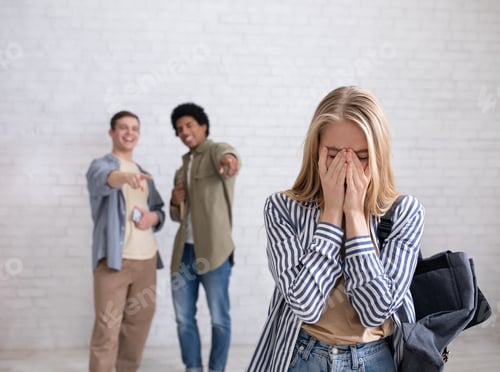 Preview: European and african american teens zoomers guys laugh at crying female with backpack in school or