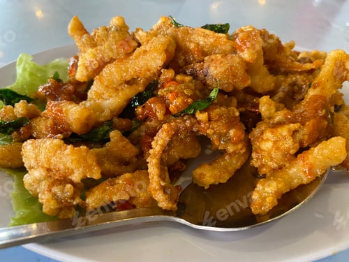 Preview: Crispy Fried Food on a Plate with Greens