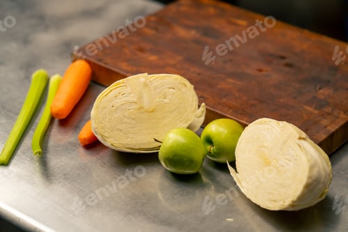 Preview: close-up in professional kitchen there are peeled vegetables and washed products on the table