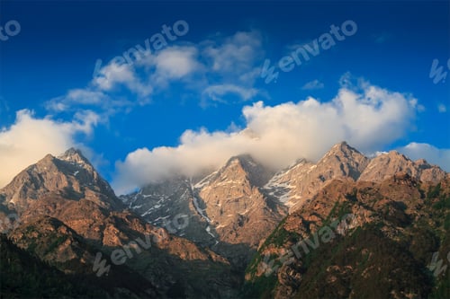 Preview: Himalayas summits in clouds on sunset