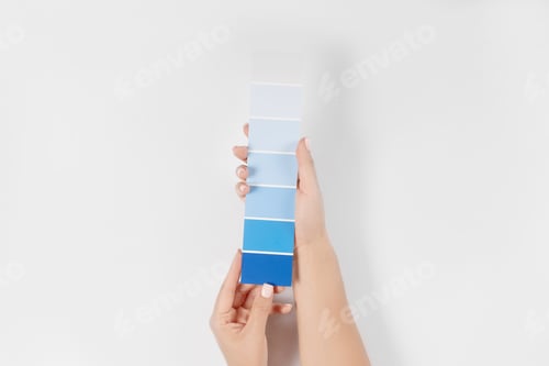 Preview: Hand holding Color samples palette design catalog.