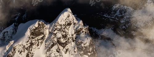 Preview: Dramatic Canadian Rocky Mountains covered in Snow.