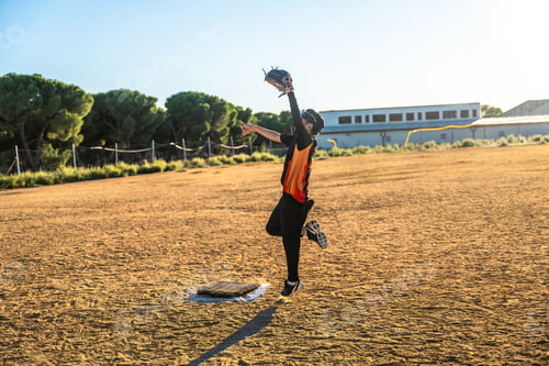 Preview: Baseball player jumping catching ball during game